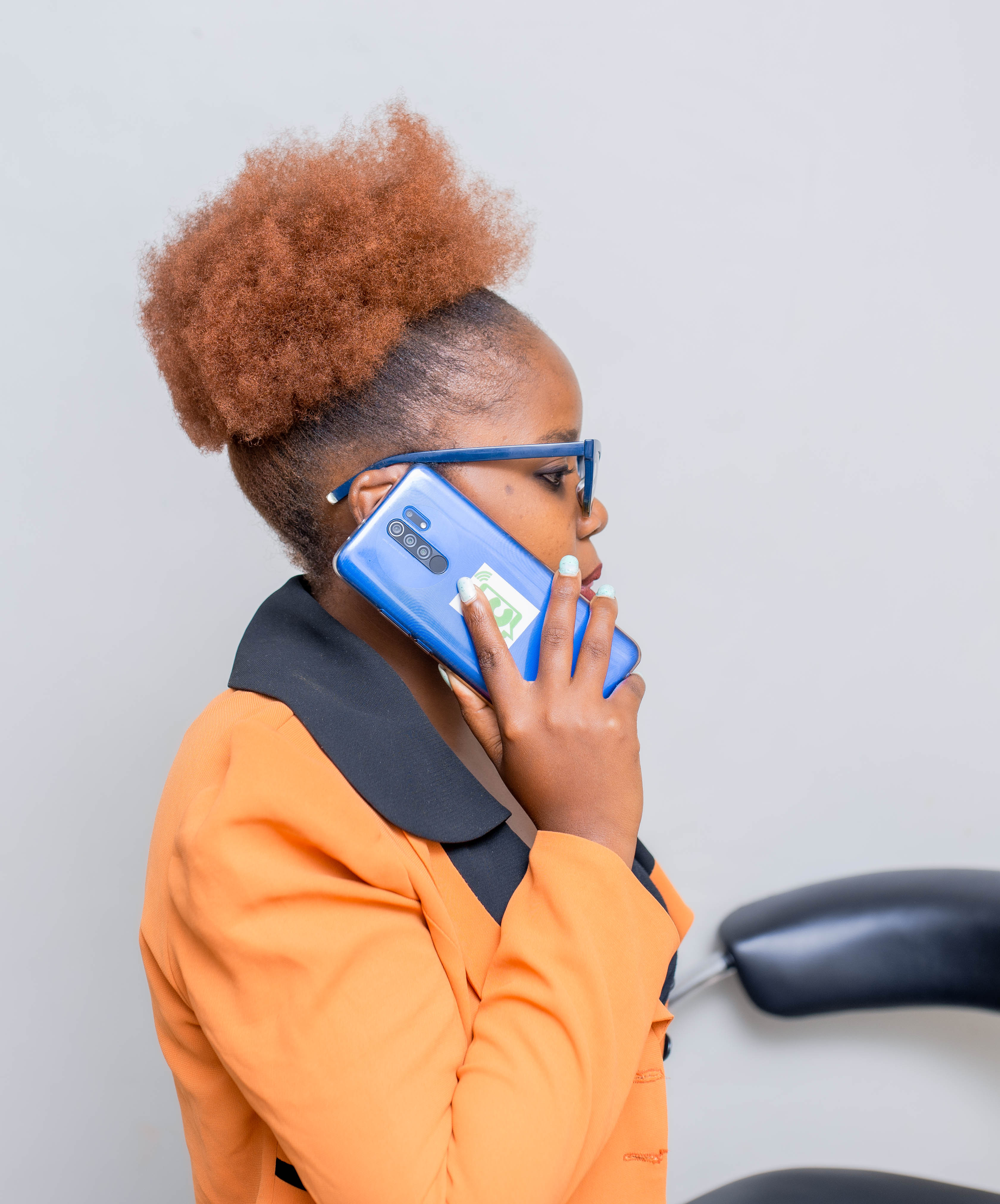 A Chiweto team member taking a call on a mobile phone